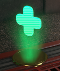 A holographic, green plus floating above a gold pedestal